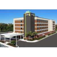 Home2 Suites by Hilton Orlando Near UCF Logo