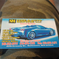 S M Tire Auto Svc LLC Logo