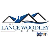 The Lance Woodley Team W/ EXP Realty Logo
