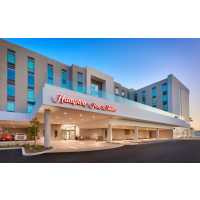 Hampton Inn  & Suites Anaheim Resort Convention Center Logo