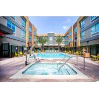 Home2 Suites by Hilton Carlsbad Logo