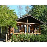 Ovenell's Heritage Inn Log Cabins, Guesthouses & Historic Ranch Logo