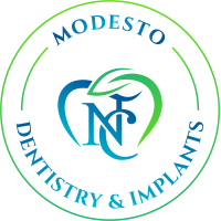 Modesto Dentistry And Implants Logo